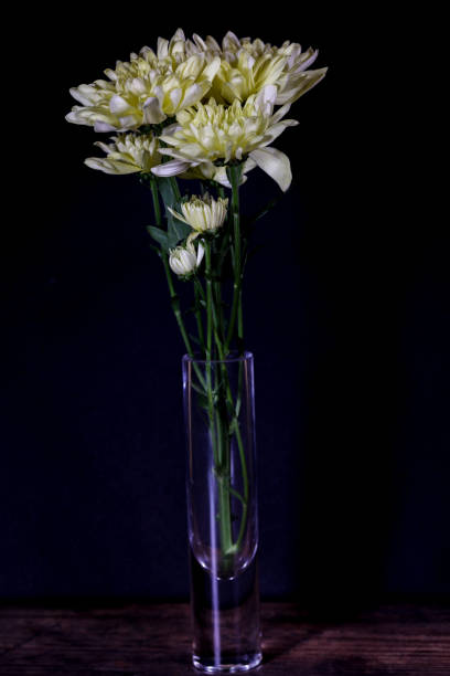 istock Yellow chrysanthemums in a glass vase 1298962138