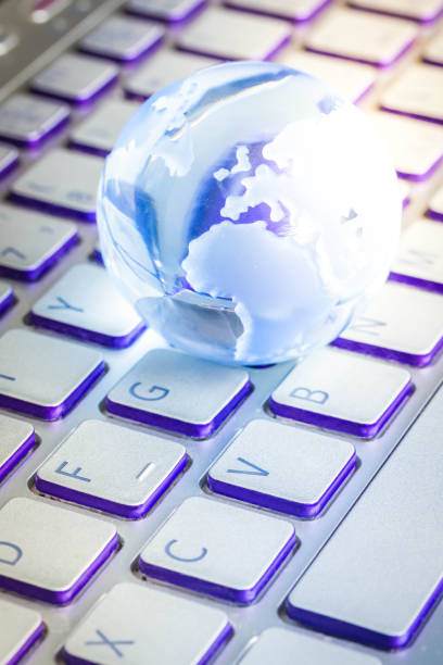 istock business concept with globe on laptop keyboard 1298962230