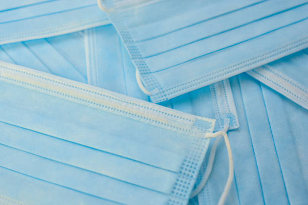 istock Pile of Surgical Masks 1298963075