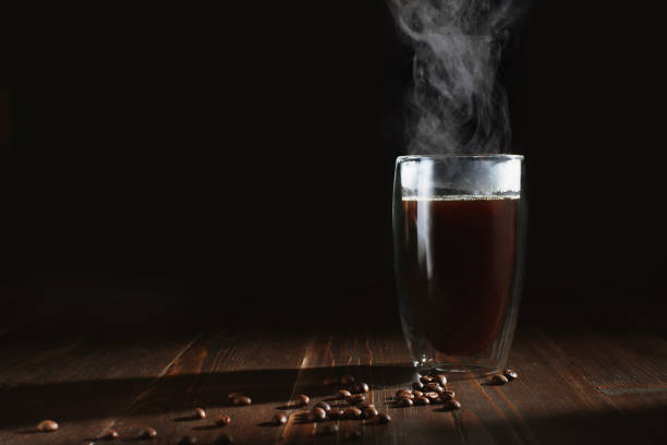 istock coffee with steam on a dark background 1298963126