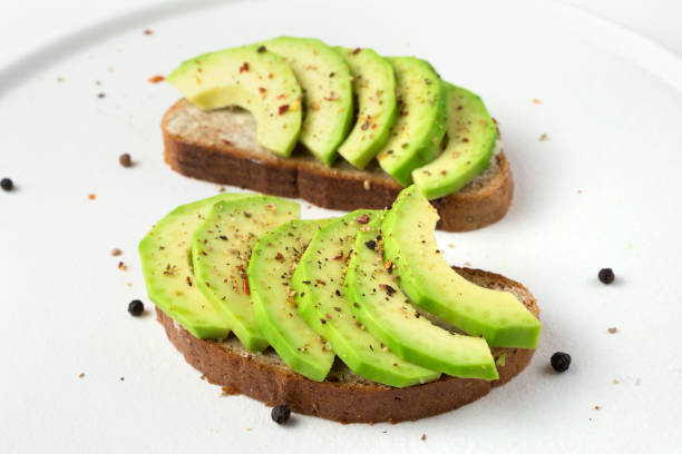 istock Vegetarian dish with avocado on a light background 1298964648