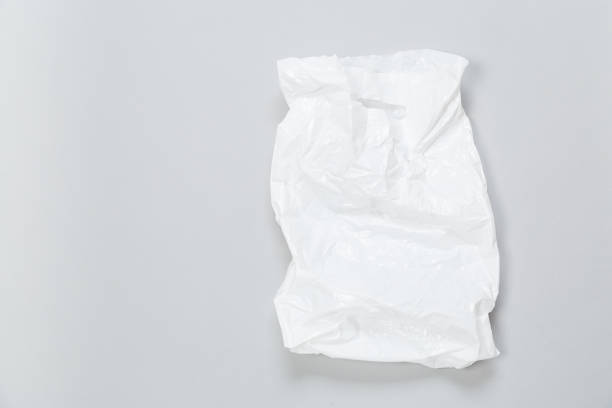 istock disposable plastic bag on grey background. Space for your text 1298964753