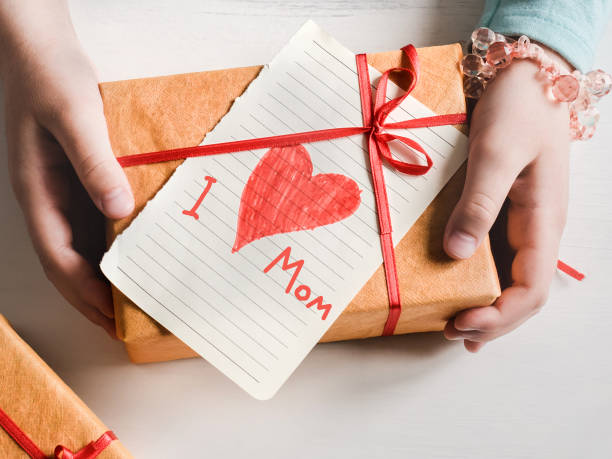istock Child's hands and a beautiful drawing. Top view 1298968156