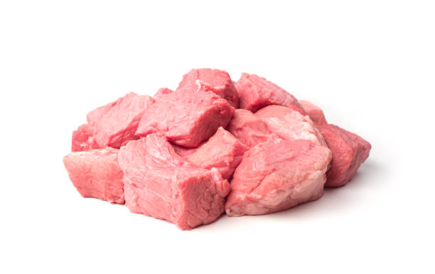 istock Fresh raw meat is cut into large chunks for frying 1298969401