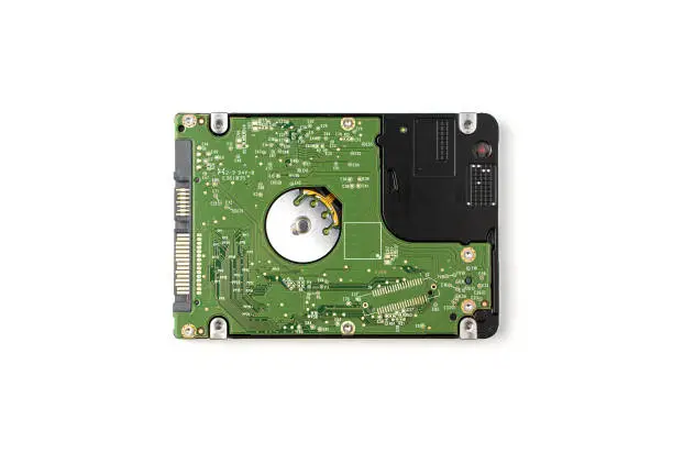 Hard disk removed from the computer on a white background. The view from the top.