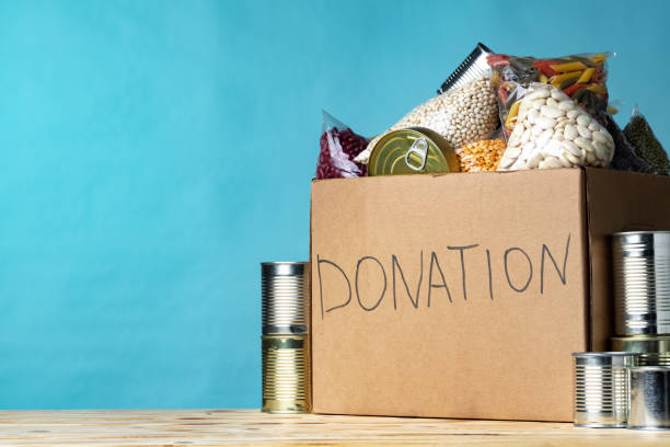 istock Food donations on the table. Text Donation. 1298969608