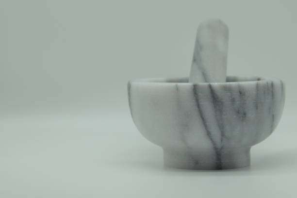 istock Mortar And Pestle Against White Background 1298970773