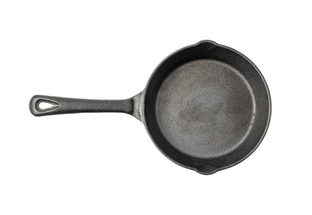 istock Cast iron frying pan top view isolated on a white background 1298970797