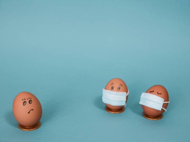 istock Easter eggs and remedies for the corona virus (COVID19). DIY masked Easter eggs to decorate your Easter holidays. Copy space. 1298971959