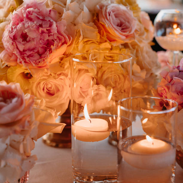 istock Beautiful Wedding Table Decoration with fresh flowers and warm lit candles 1298975751