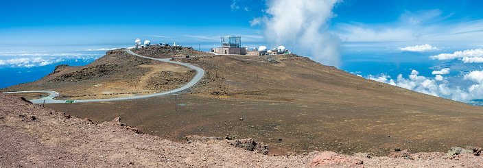 Haleakala Observatory on the island of Maui, also known as the Haleakala High Altitude Observatory Site, is the location of Hawaii's first astronomical research observatory. It is owned by the Institute for Astronomy of the University of Hawai'i, which operates some of the facilities on the site and leases portions to other organizations. At over 3,050 meters (10,010 ft) in altitude, the summit of Haleakala is above one third of the Earth's atmosphere and has excellent astronomical seeing conditions. Science City