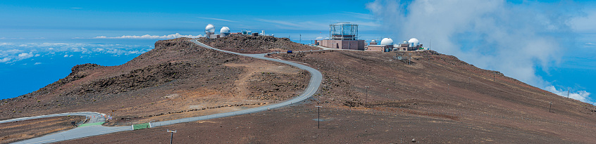 Haleakala Observatory on the island of Maui, also known as the Haleakala High Altitude Observatory Site, is the location of Hawaii's first astronomical research observatory. It is owned by the Institute for Astronomy of the University of Hawai'i, which operates some of the facilities on the site and leases portions to other organizations. At over 3,050 meters (10,010 ft) in altitude, the summit of Haleakala is above one third of the Earth's atmosphere and has excellent astronomical seeing conditions. Science City\