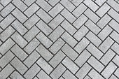 Sidewalk gray tiles diagonally. Texture, pattern. Copy space