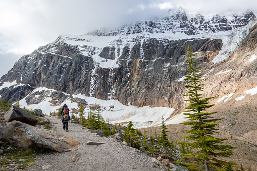 A mother and her son are hiking at at Mount Edith Cavell, Alberta, Canada.