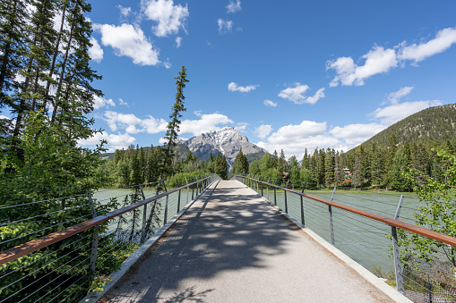 Bridge over Bow River in Banff National Park, Alberta, Canada on a sunny summer day.