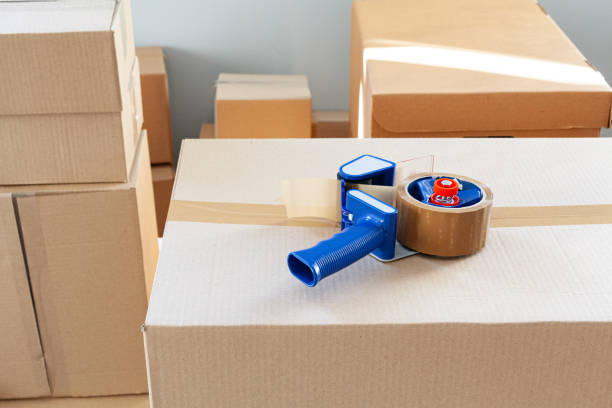 istock House moving concept with stacked cardboard boxes in a room 1298978760
