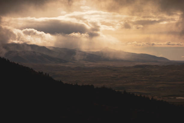 istock Dramatic weather above Patagonian plain with silhouetted mountain ridge in foreground 1298979856