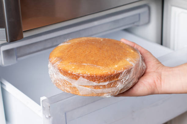 istock Fresh sponge cake. Frozen sponge cake in the freezer. 1298980066
