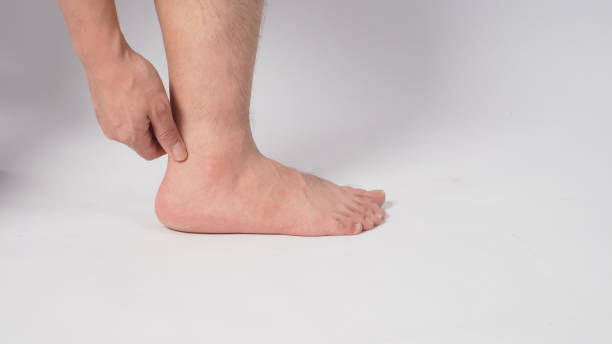 istock Male barefoot and hand is isolated on white background. 1298981071