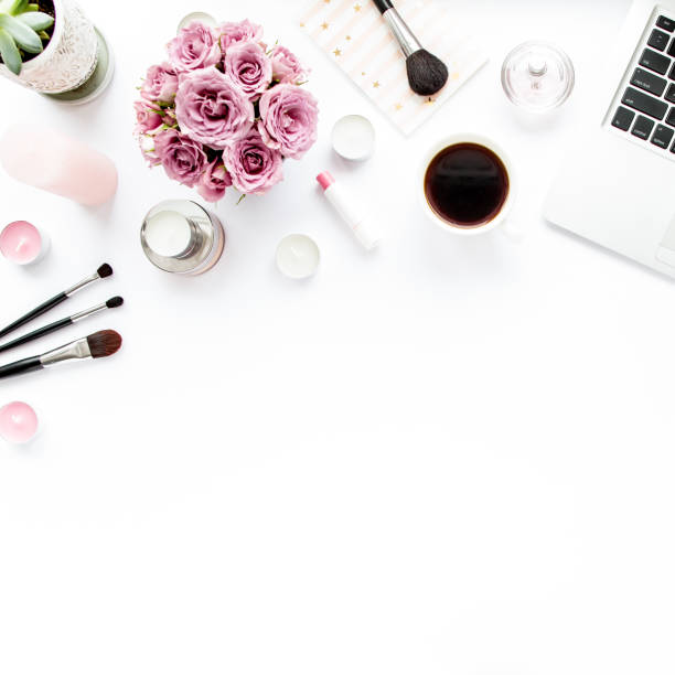 istock Makeup tools. Home office workspace. Female fashion, makeup brushes, cup of coffee on white background. Flat composition. Top view. Flat lay 1298983833