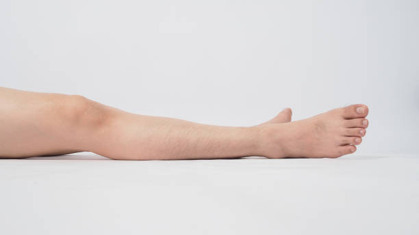 istock Male legs is isolated on white background. 1298984359