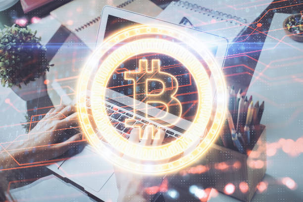 istock Crypto currency theme hologram with businessman working on computer on background. Concept of blockchain. Double exposure. 1298984456