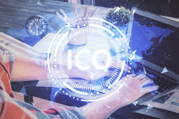 istock Crypto currency theme hologram with businessman working on computer on background. Concept of blockchain. Multi exposure. 1298985321