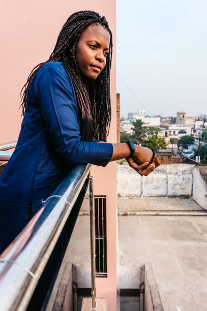 istock Sad woman contemplating on balcony 1298985874