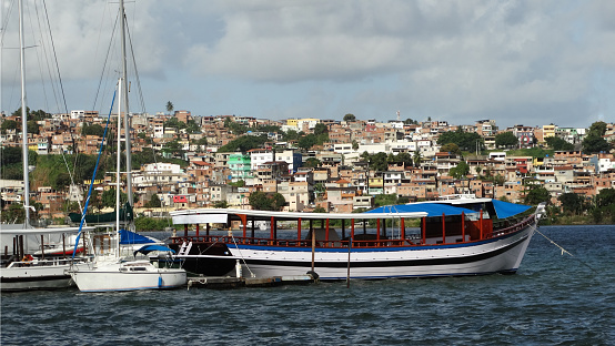 Barcos pesqueros, de turismo y otros en la Bahía de Salvador, Brasil, con la Colorida Ciudad al fondo. Pesca, turismo y otros barcos en bahía de Salvador, Brasil, con la Ciudad Colorida al fondo photo