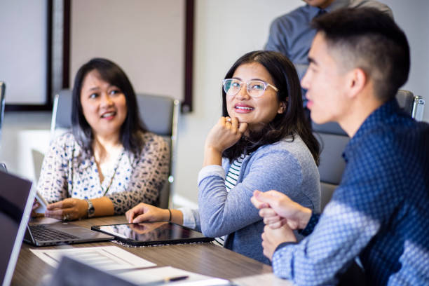 istock Diverse Staff Meeting in Conference Room 1298989400