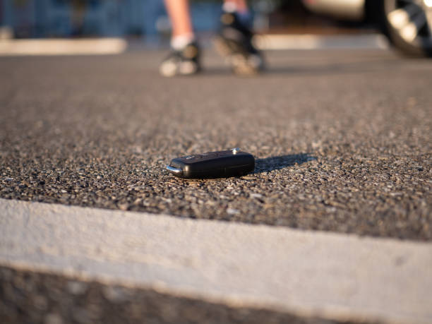 istock A man walking away after losing his car key on a parking. 1298990191