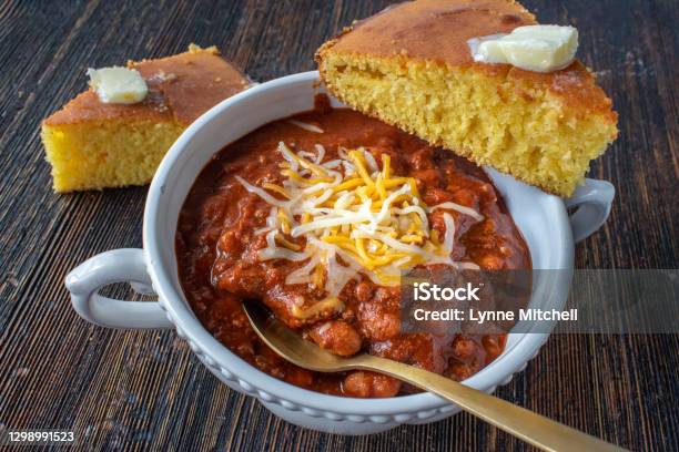 Closeup Of Bowl Of Homemade Chili With Cornbread Stock Photo - Download Image Now - Chili Con Carne, Corn Bread, Cheese