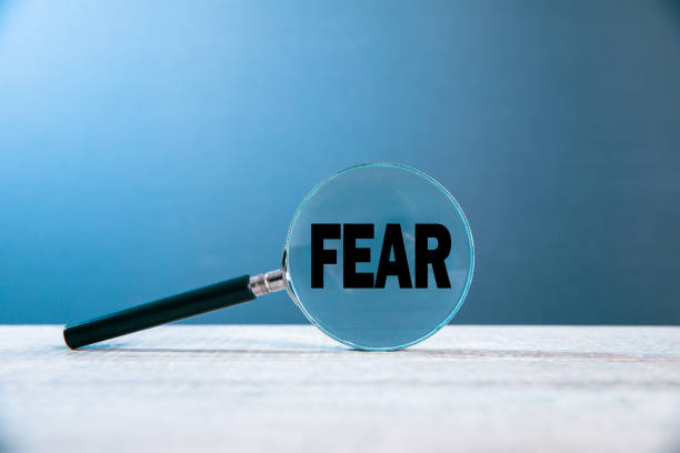 istock Magnifier glass with word FEAR 1298992691
