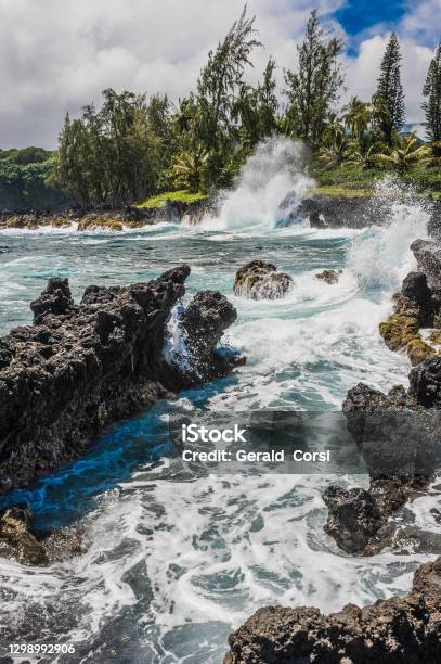 Pacific Ocean Waves Breaking On A Rocky Beach By The Hana Road In Maui Hawaiian Islands Stock Photo - Download Image Now