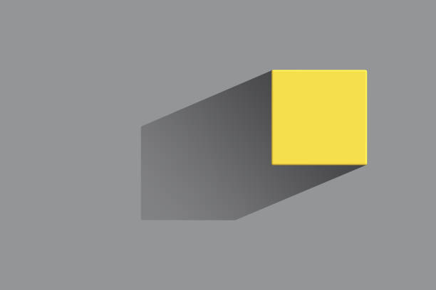 cubo giallo con un'ombra nitida su uno sfondo grigio. colorato nel 2021 tendenze di colore ultimate gray e illuminating. stile minimalista. - pantone 2021 foto e immagini stock