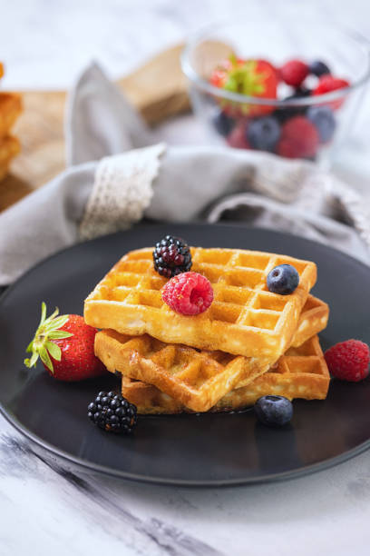 istock Waffles with Fresh Berries and Maple Syrup 1298994058