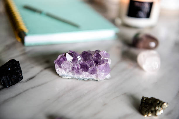 istock Flat lay of healing crystals and notebook 1298996662