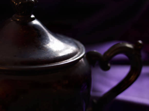 Light from nearby window gently illuminates teapot.