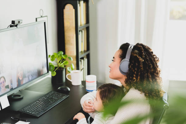 istock Busy mom participating in video conference 1298996916