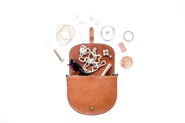 istock Makeup tools. Home office workspace. Female fashion, makeup brushes, cup of coffee on white background. Flat composition. Top view. Flat lay 1298997702