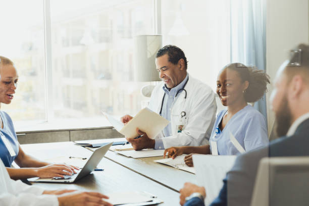 istock Doctors discuss healthcare matters during staff meeting 1298997708