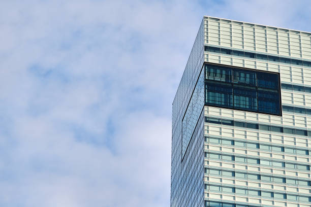 istock Urban Office Building Closeup with Cloudy Sky 1298999470
