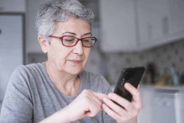 istock Senior Woman With Smartphone 1299002357