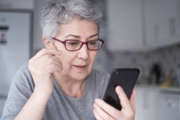istock Senior Woman With Smartphone 1299002375