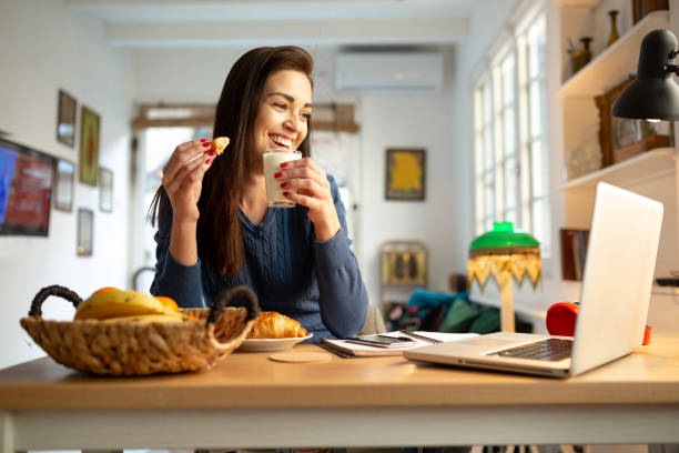 istock Beautiful Caucasian woman working from home 1299002584