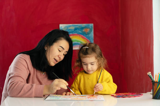 istock Mother And Preschooler Daughter Homeschooling 1299002596