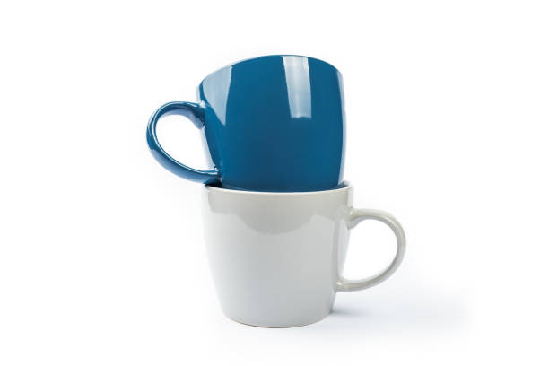 istock blank ceramic colored cup isolated over white background. stack of teacup cut out 1299003201