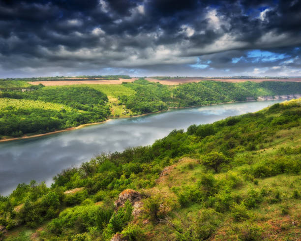 istock Beautiful spring landscape at sunrise. clouds over a picturesque canyon 1299003252