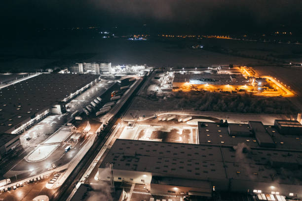 istock Aerial view of the trucks unloading at the logistic center. 1299005710