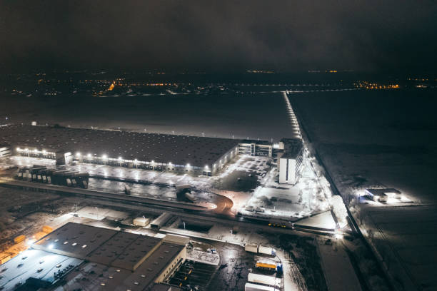 istock Aerial view of the trucks unloading at the logistic center. 1299005805